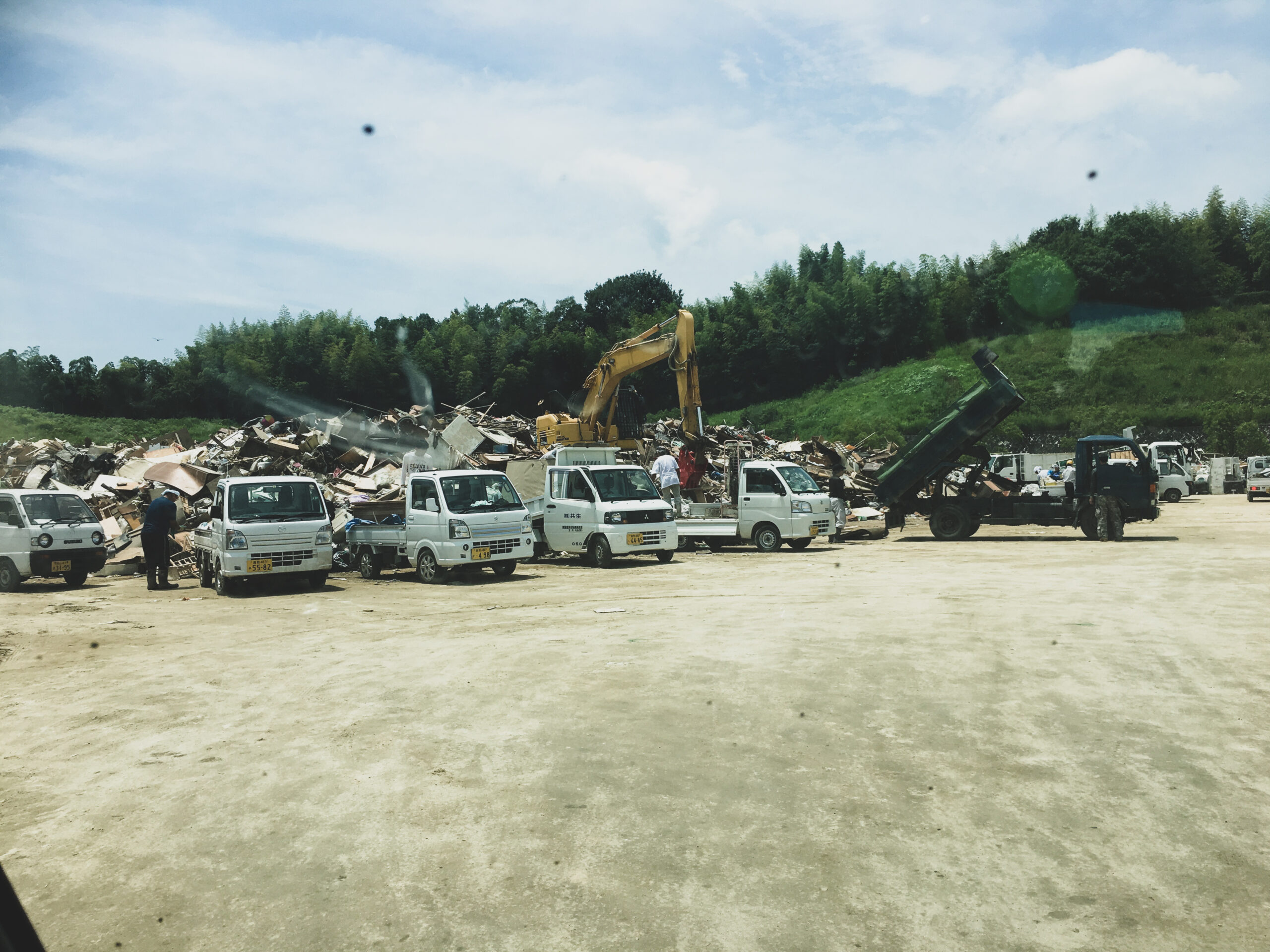 Mini Trucks Gathered at Mabi-cho's Waste Collection Site